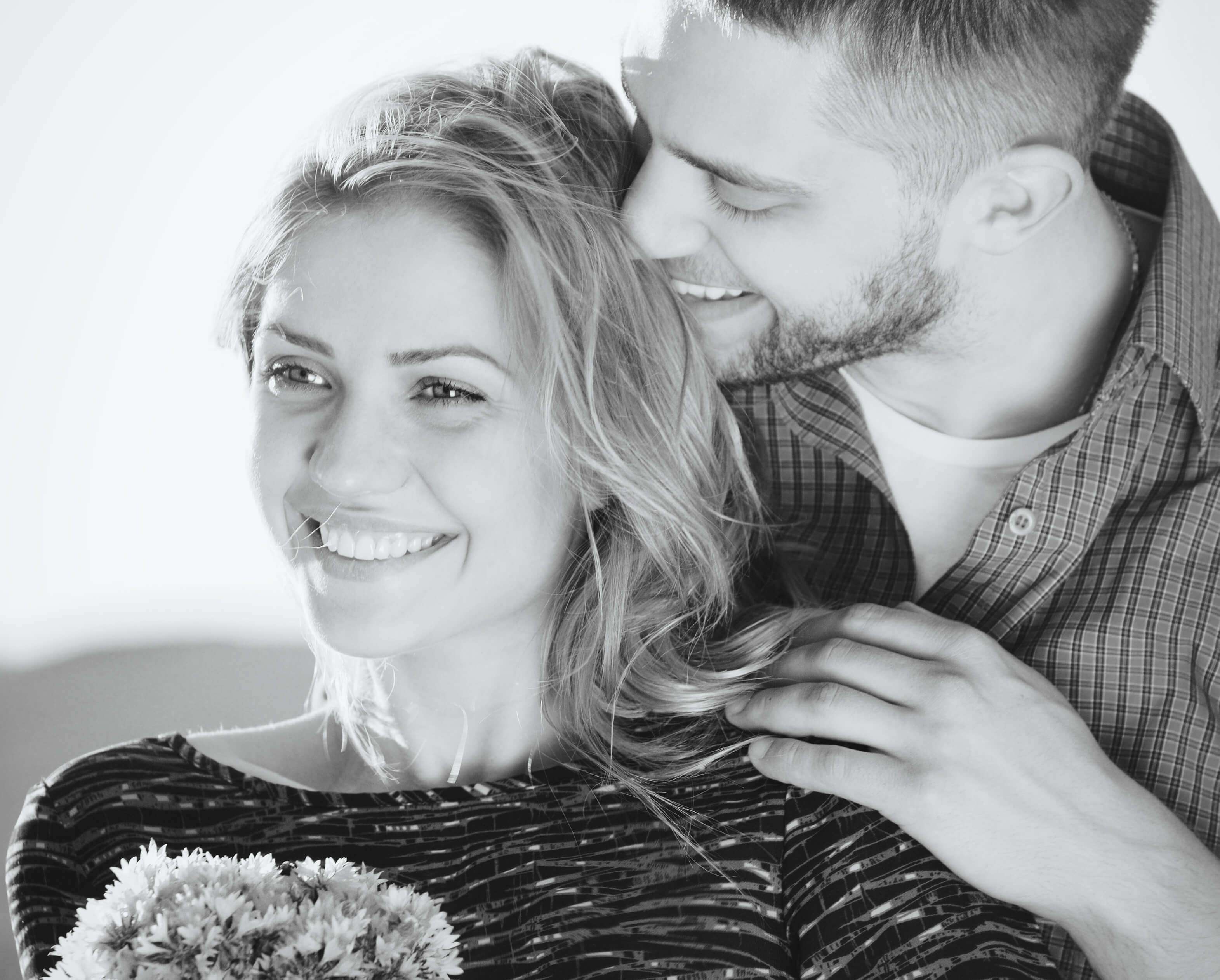black and white portrait of emotional sensual young couple in su