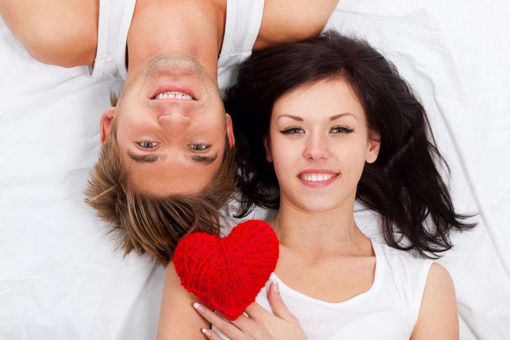 Young love couple in bed